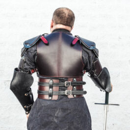 the back view of the man in the leather armor