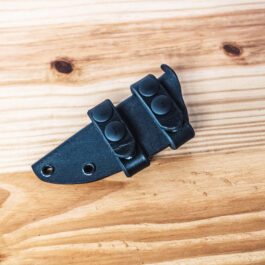 A kydex sheath for the benchmade raghorn with two leather scout straps