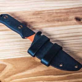 A kydex sheath for the benchmade raghorn with two leather scout straps