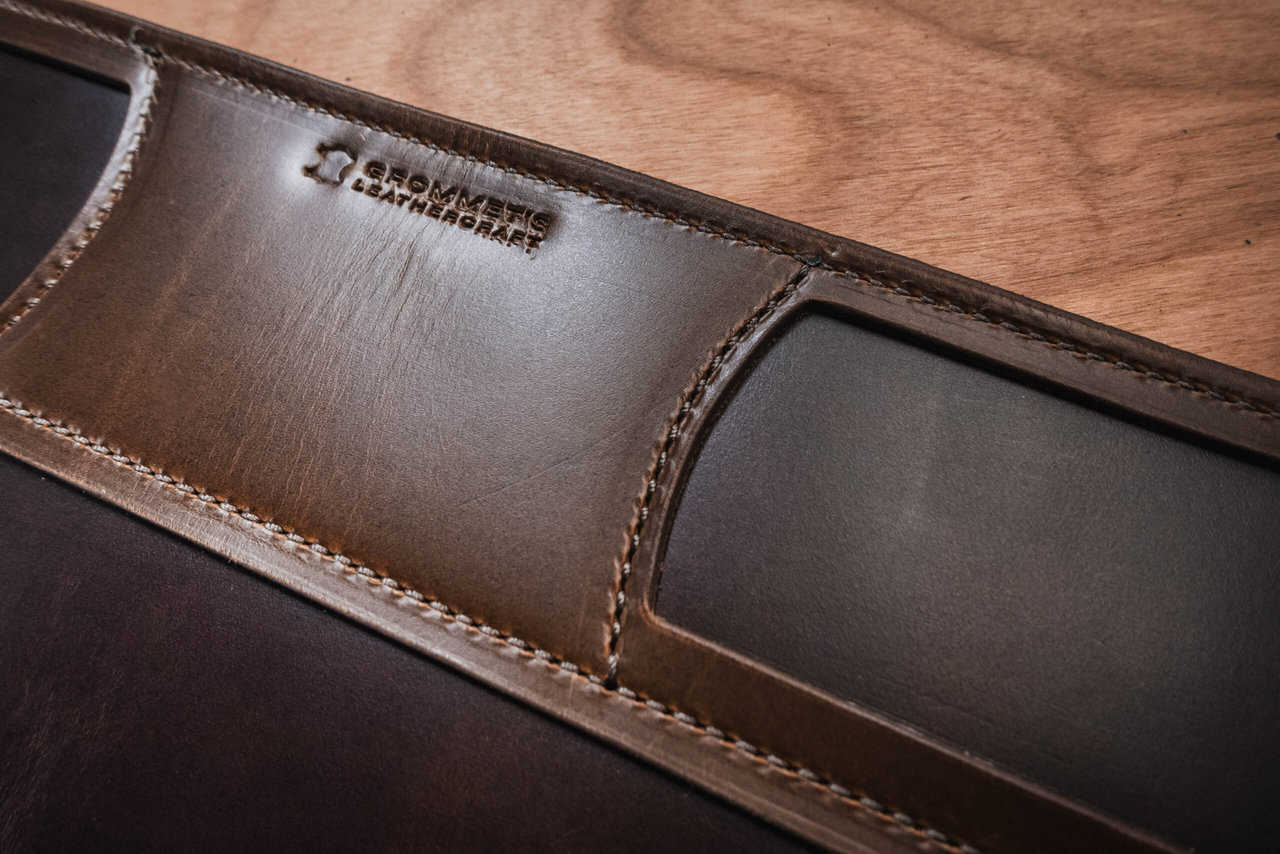 a brown leather mat on a wooden table