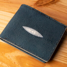 A leather wallet sitting on a wooden table