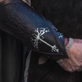 A close up of a person wearing Strider Vambraces.