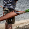 A man holding a Ranger Hip Quiver.