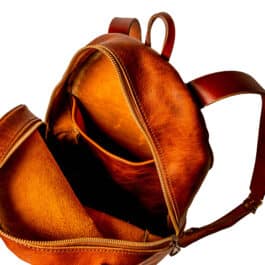 a light brown backpack on a white background